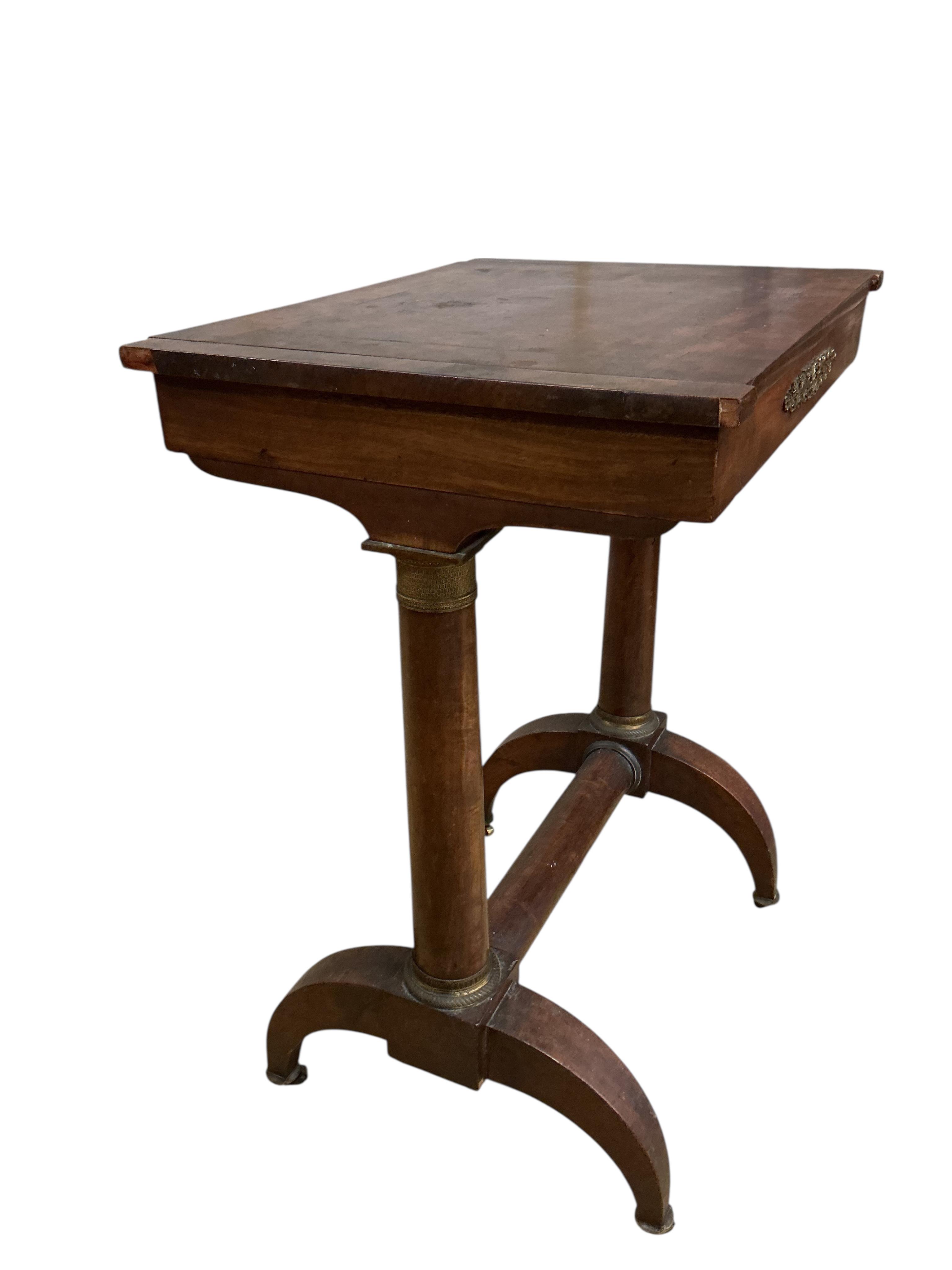 An early 19th century French gilt metal mounted mahogany games table, width 54cm, depth 41cm, height 70cm. Condition - fair